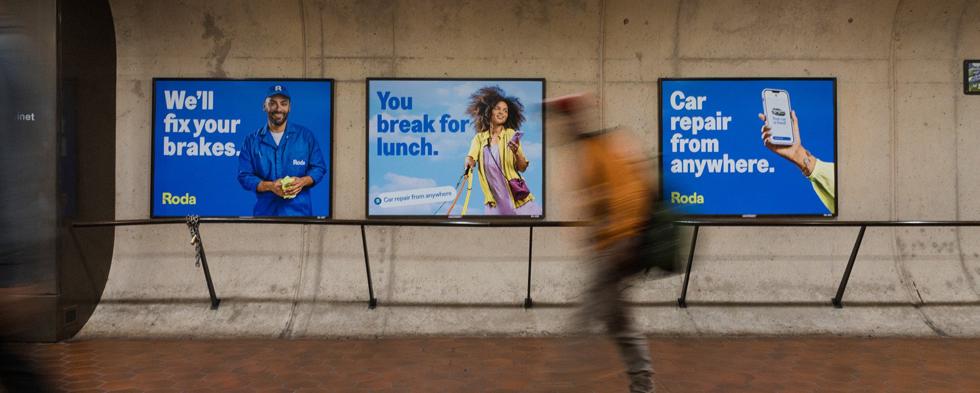 Roda car repair campaign on transit billboards in a Washington, DC Metro station